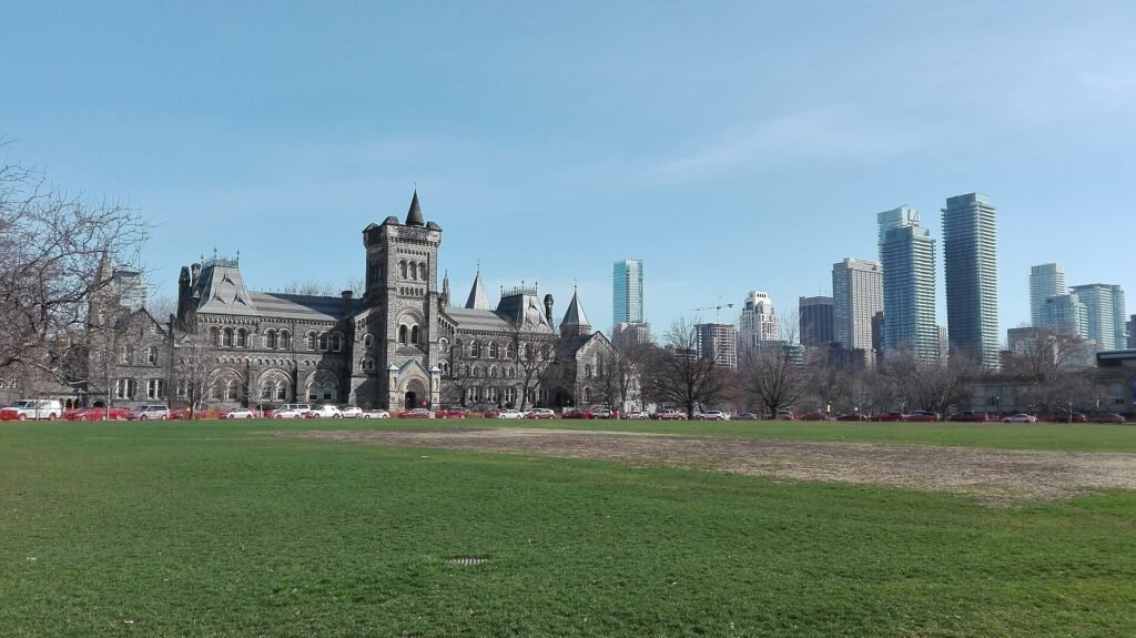 University College at the University of Toronto with the city skyline behind it