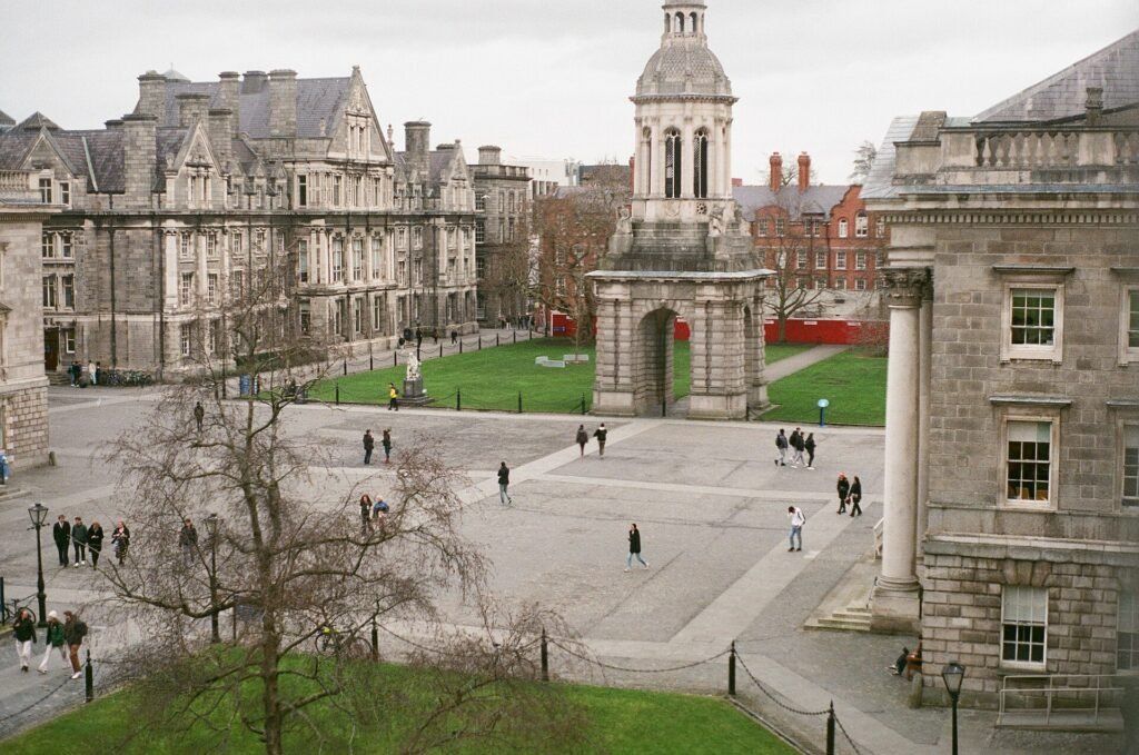 Students crossing Front Square at Trinity College Dublin in Ireland