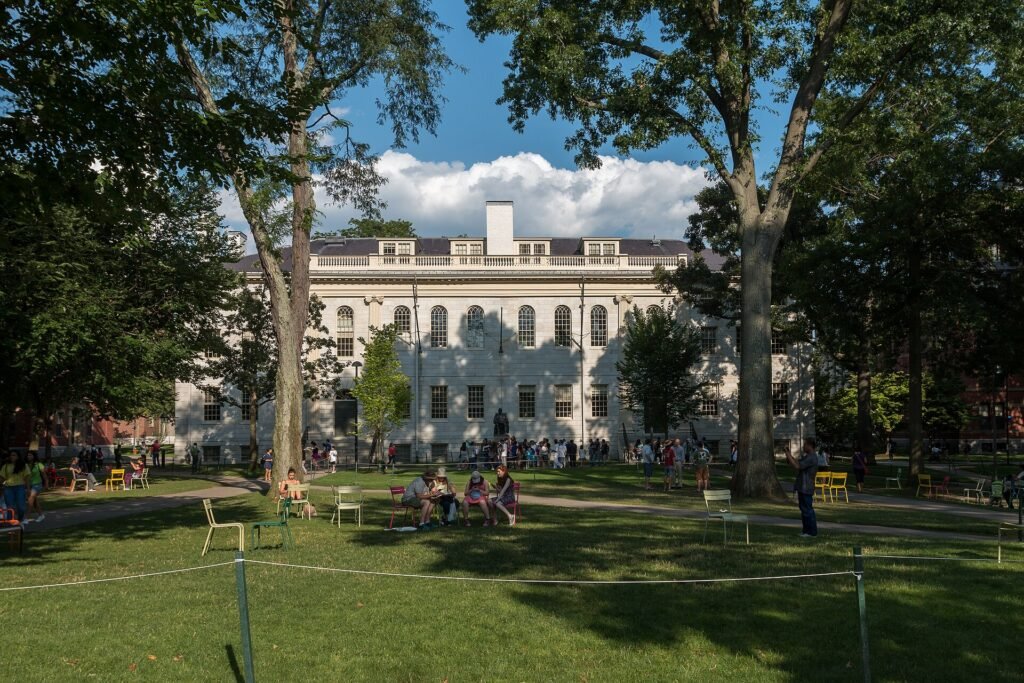 Students relaxing on the lawn of Harvard Yard in the USA